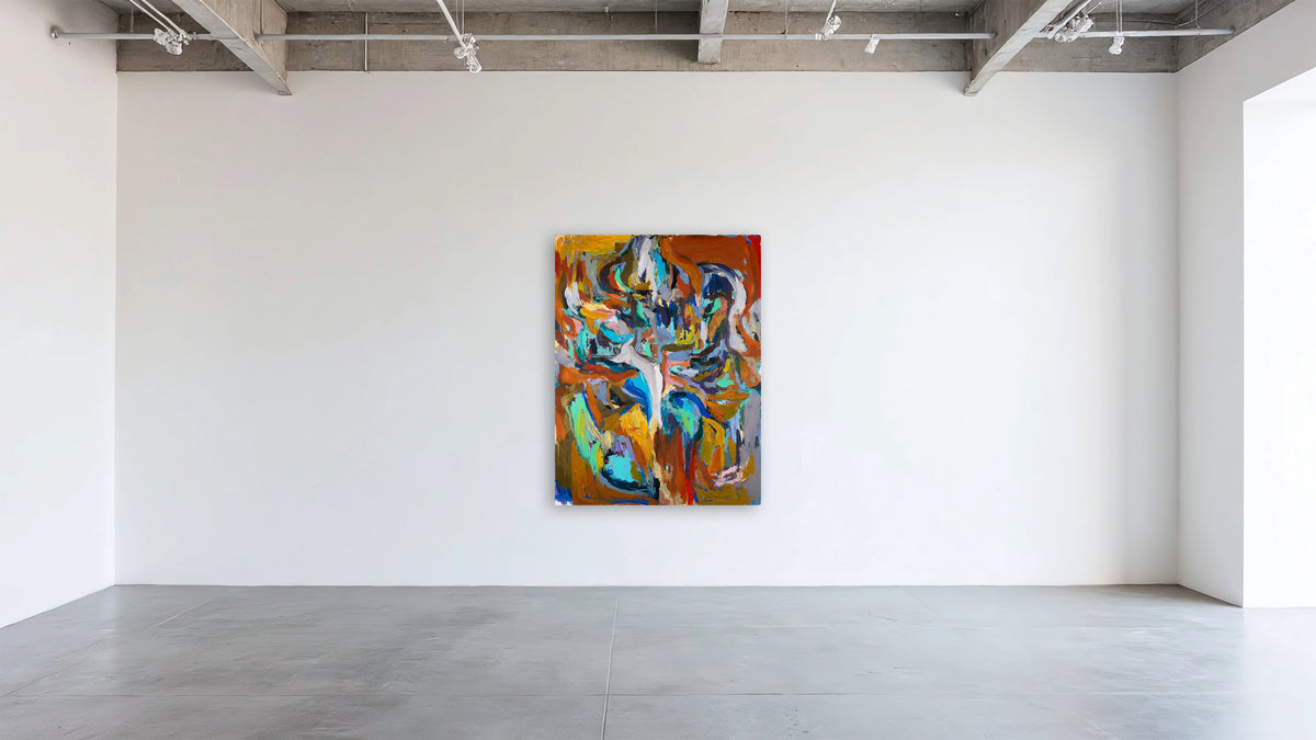 An abstract canvas painting by Ethan Newman with vibrant orange, blue, yellow, and green brushstrokes, displayed on a white gallery wall in a modern studio with concrete floors.